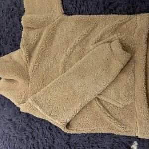 Fluffy comfy tan sweater with a turtle neck